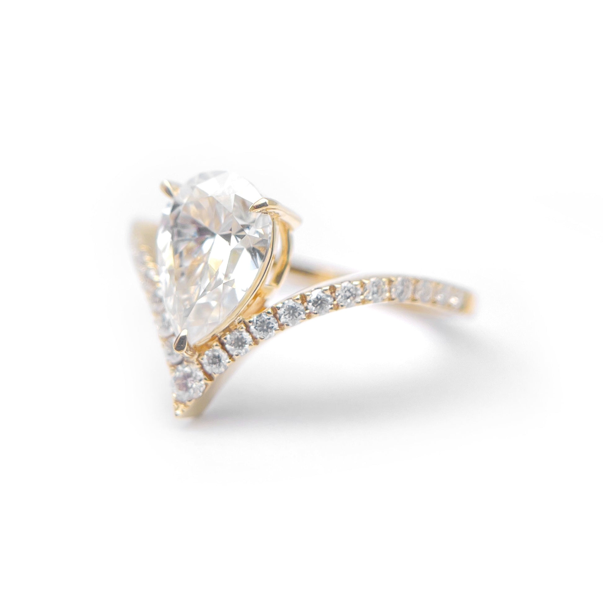 Pear Moissanite Ring in Silver and Gold