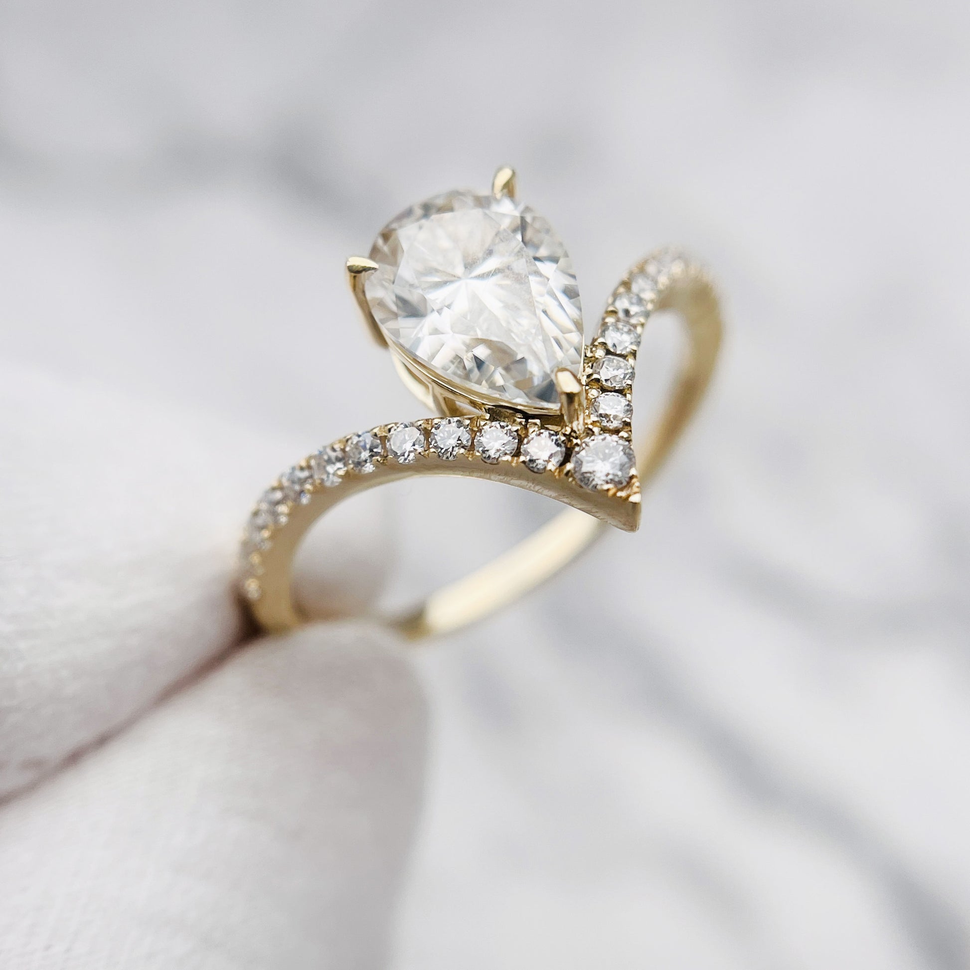 Pear Moissanite Ring in Silver and Gold